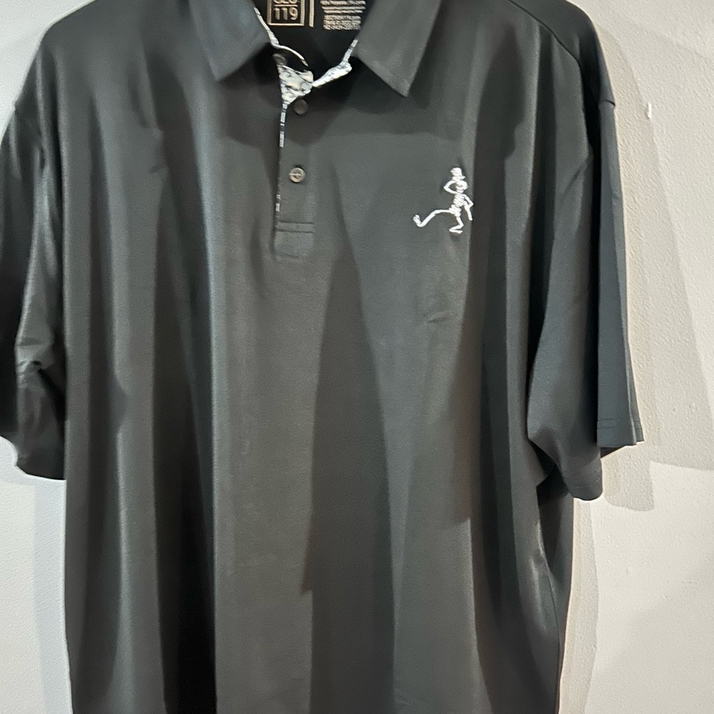 Elegant Black Polo Shirt with Embroidered Design. Grateful Dead